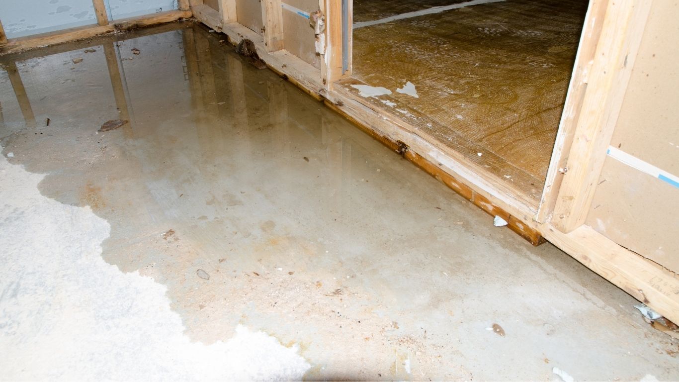 Dry, Dehumidify, Disinfect Flood Damage Restoration in New Haven, CT Flood damage restoration New Haven, CT service addressing standing water on a concrete floor.